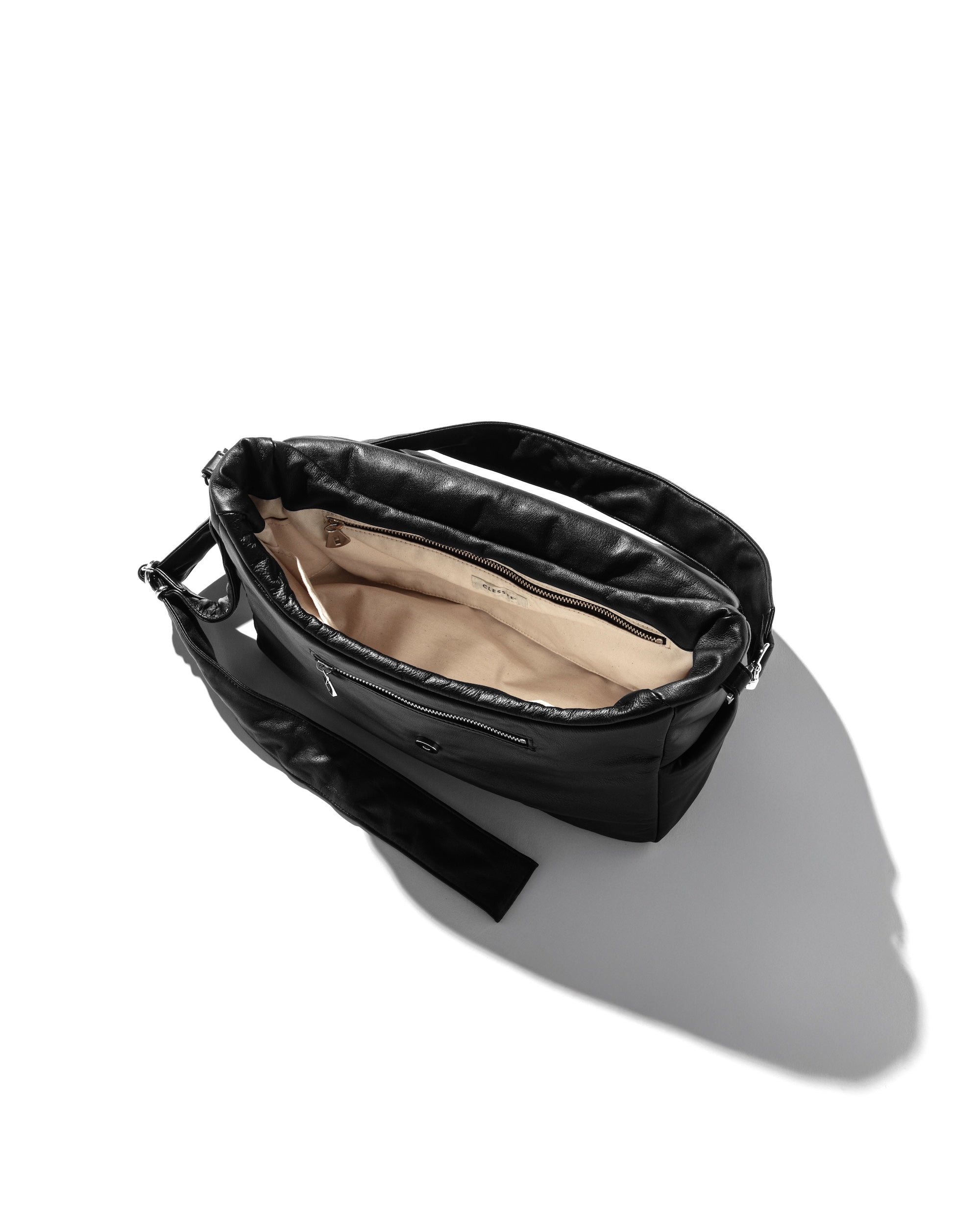 CLESSTE LEATHER PADDED FLAP HOLIDAY BAG