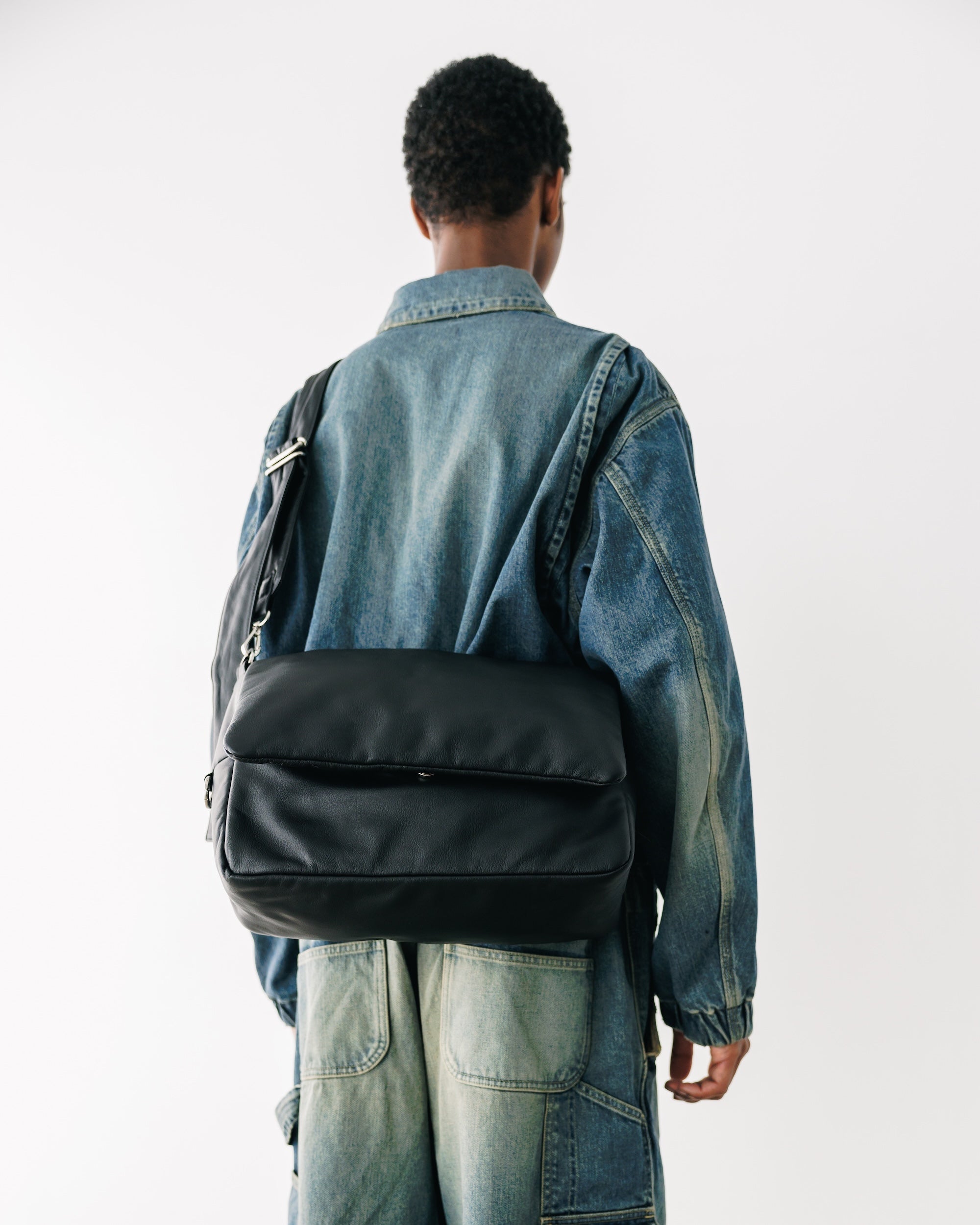 CLESSTE LEATHER PADDED FLAP HOLIDAY BAG