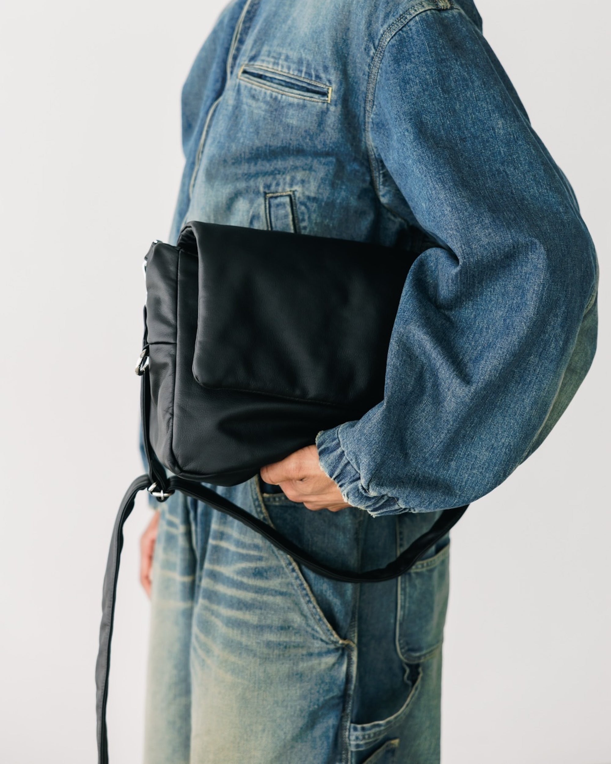 CLESSTE LEATHER PADDED FLAP HOLIDAY BAG