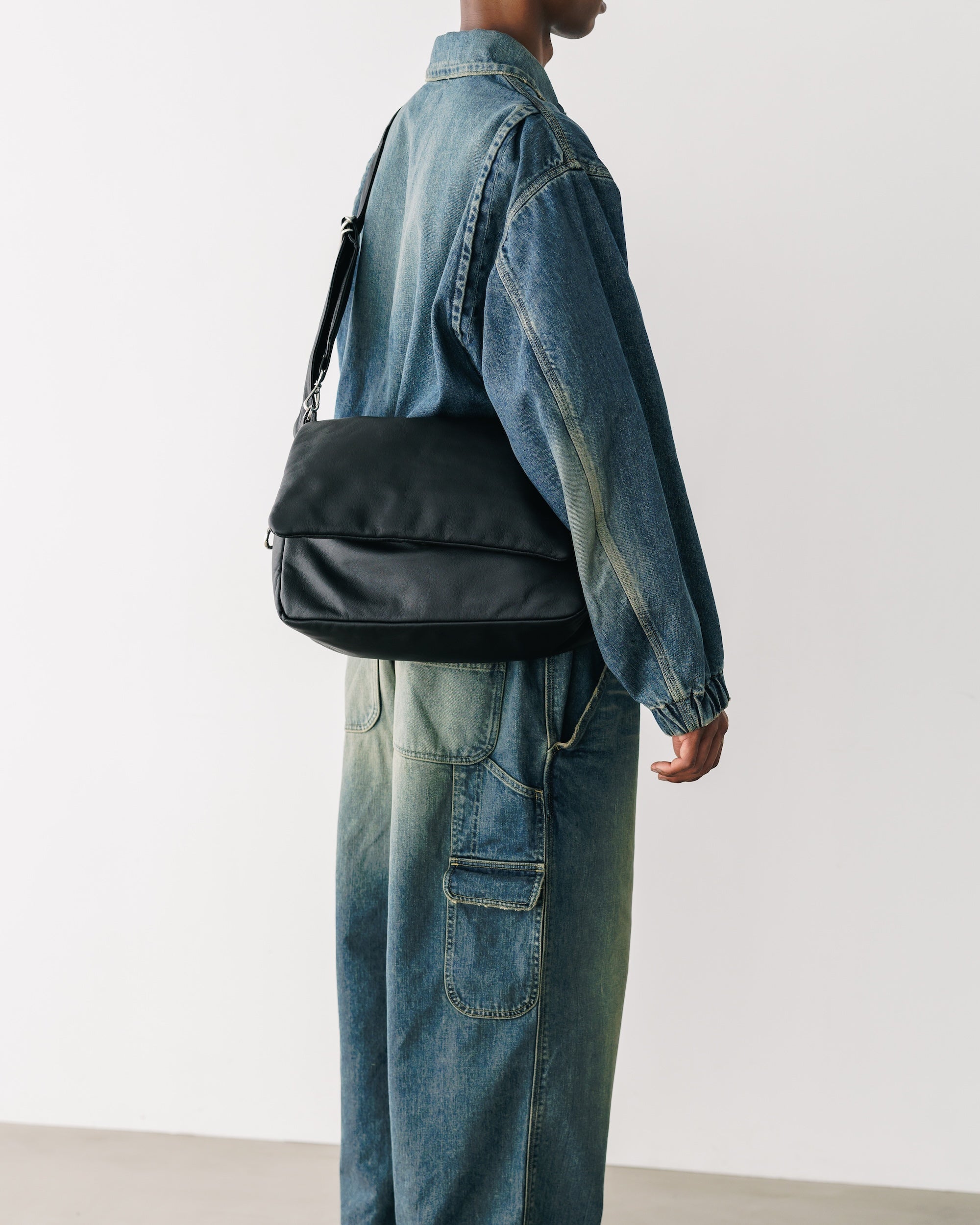 CLESSTE LEATHER PADDED FLAP HOLIDAY BAG