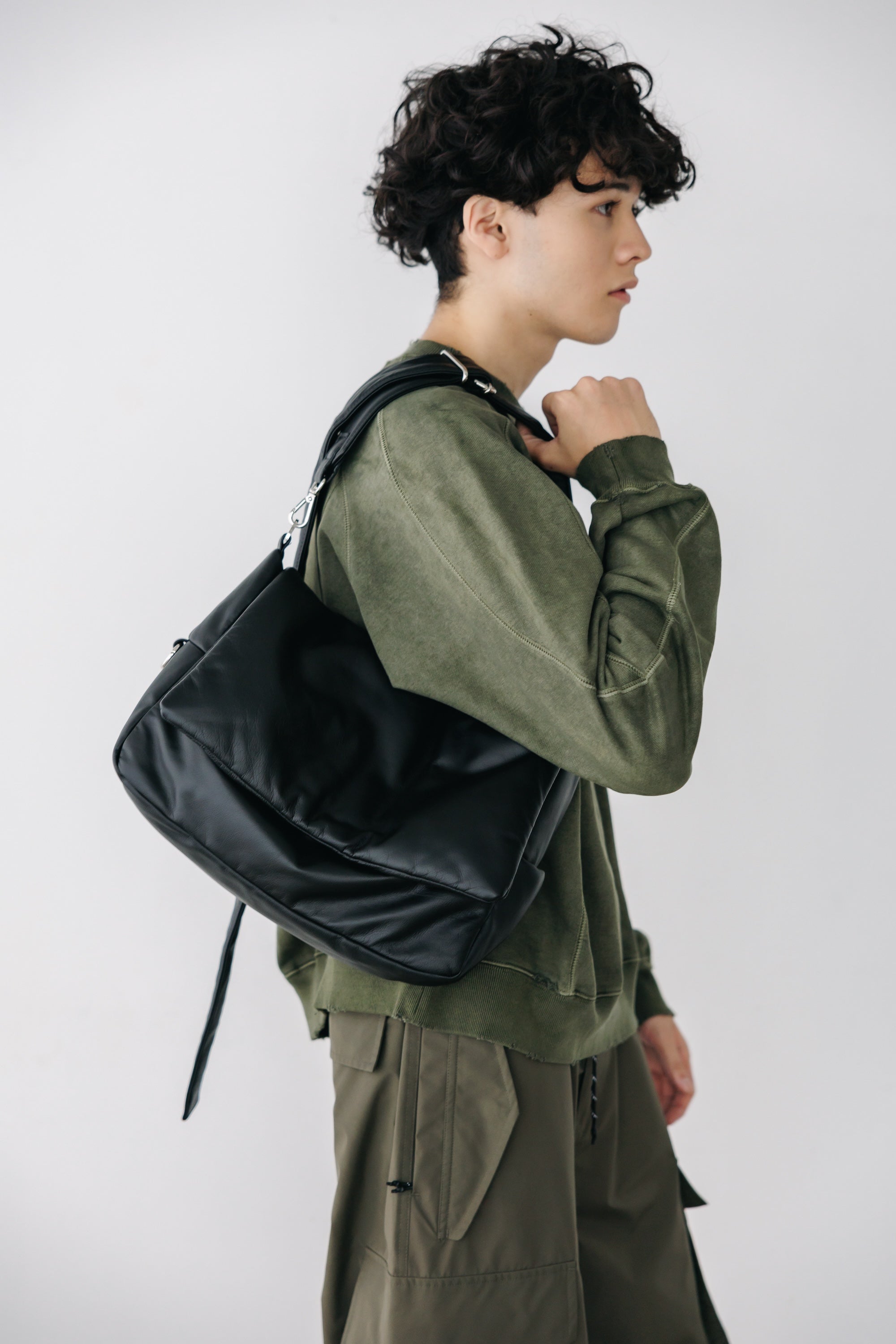 CLESSTE LEATHER PADDED FLAP HOLIDAY BAG