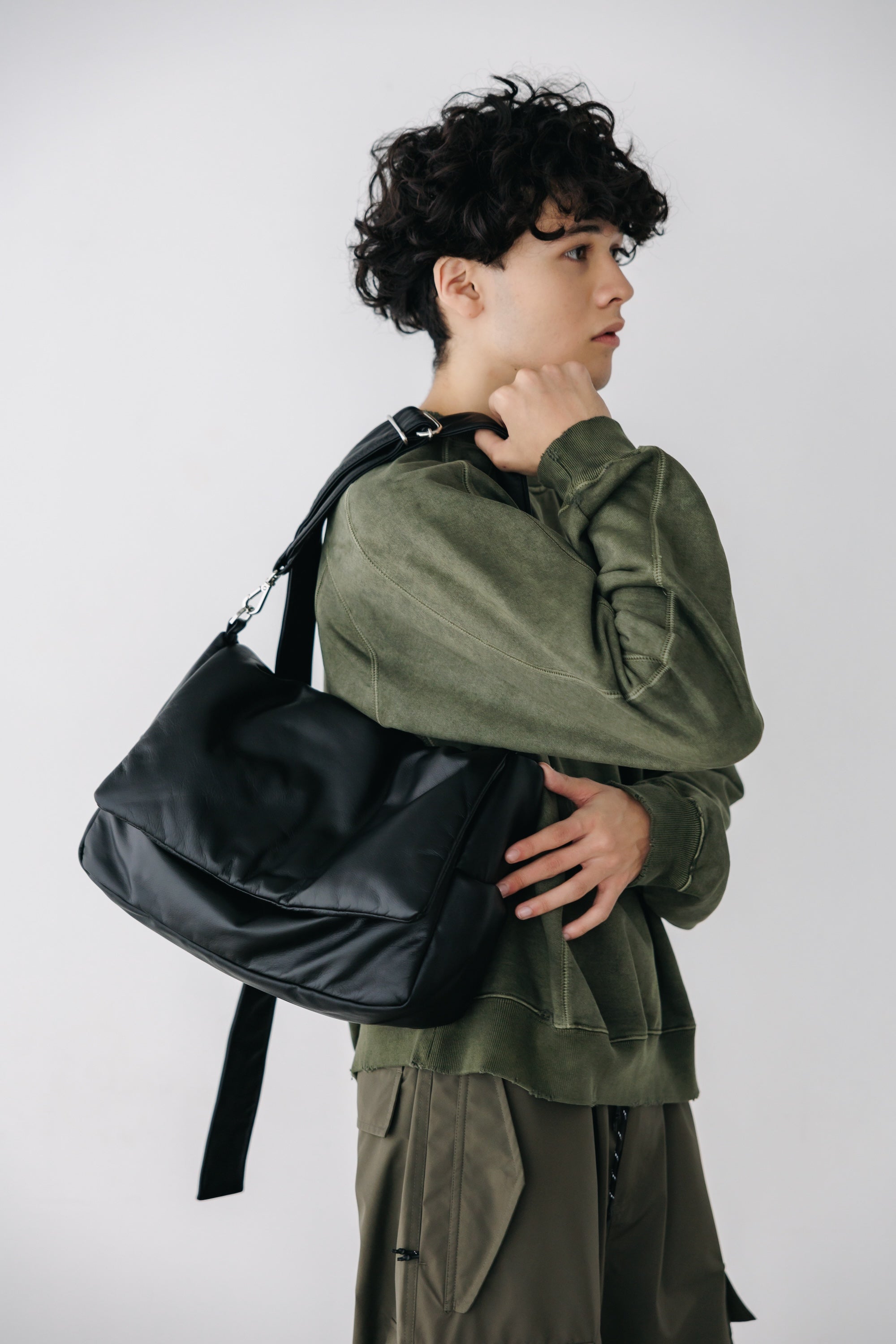 CLESSTE LEATHER PADDED FLAP HOLIDAY BAG