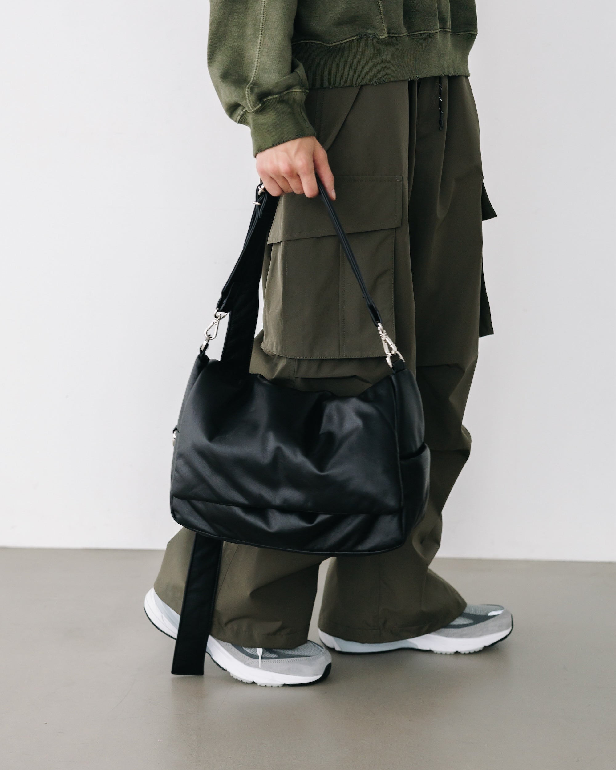 CLESSTE LEATHER PADDED FLAP HOLIDAY BAG