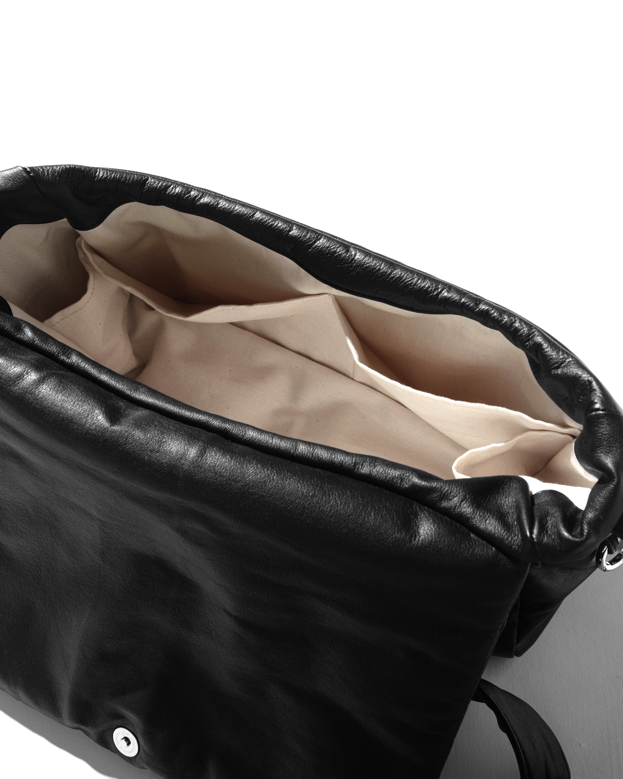 CLESSTE LEATHER PADDED FLAP HOLIDAY BAG