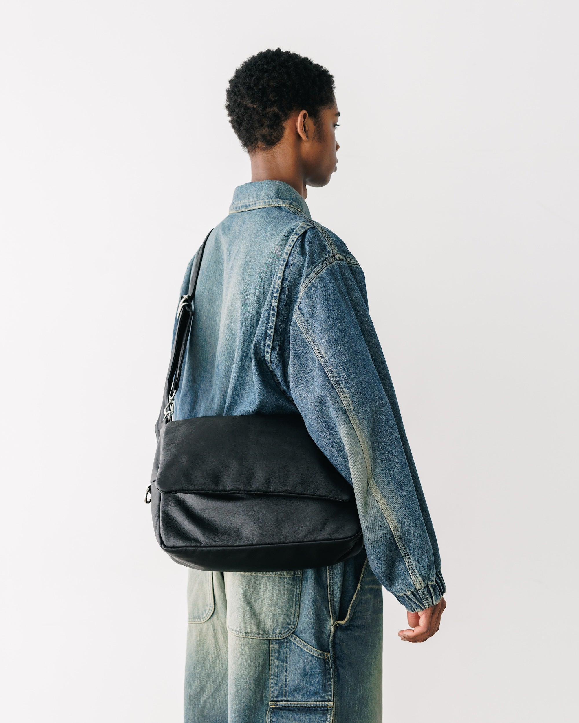 CLESSTE LEATHER PADDED FLAP HOLIDAY BAG