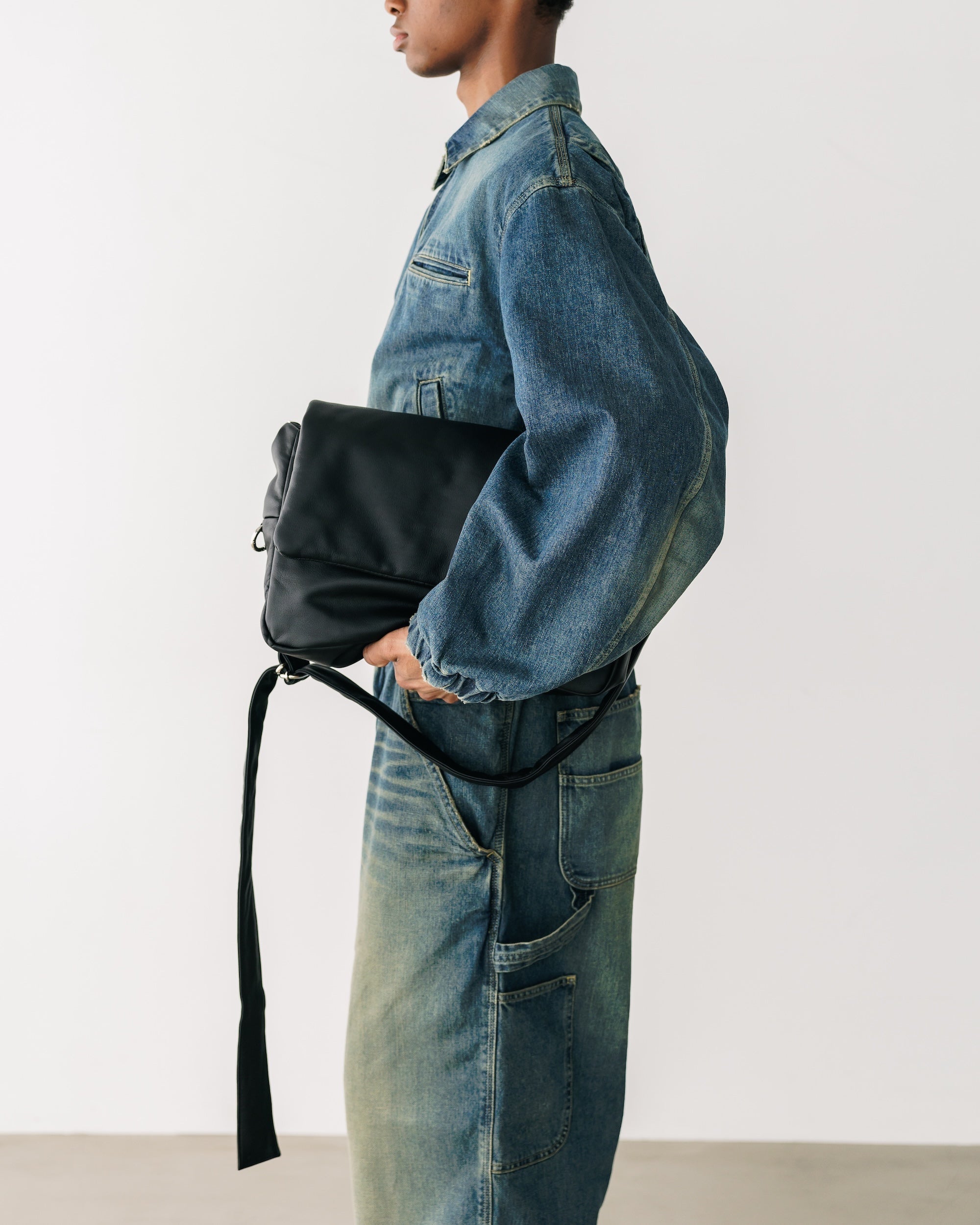 CLESSTE LEATHER PADDED FLAP HOLIDAY BAG
