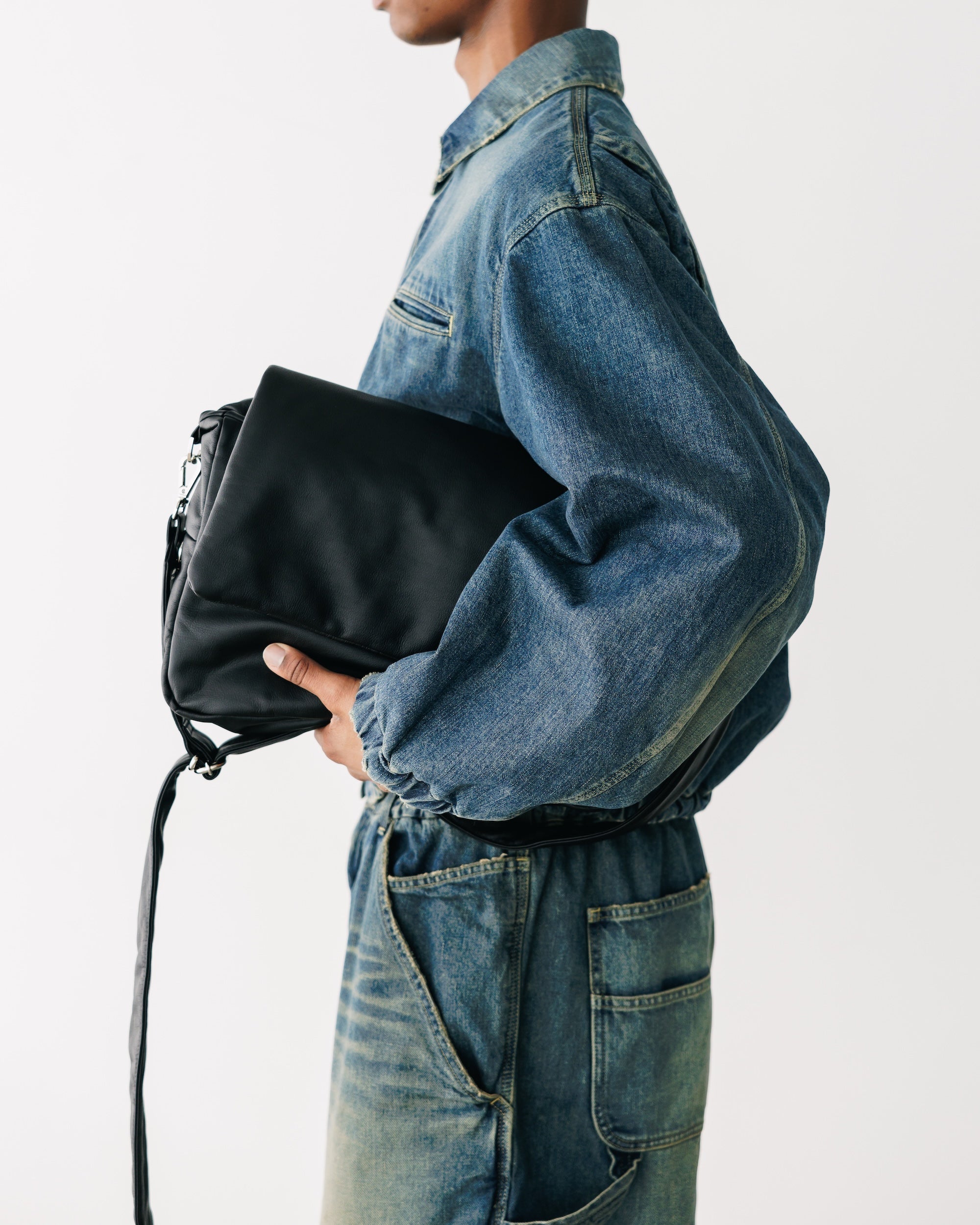 CLESSTE LEATHER PADDED FLAP HOLIDAY BAG