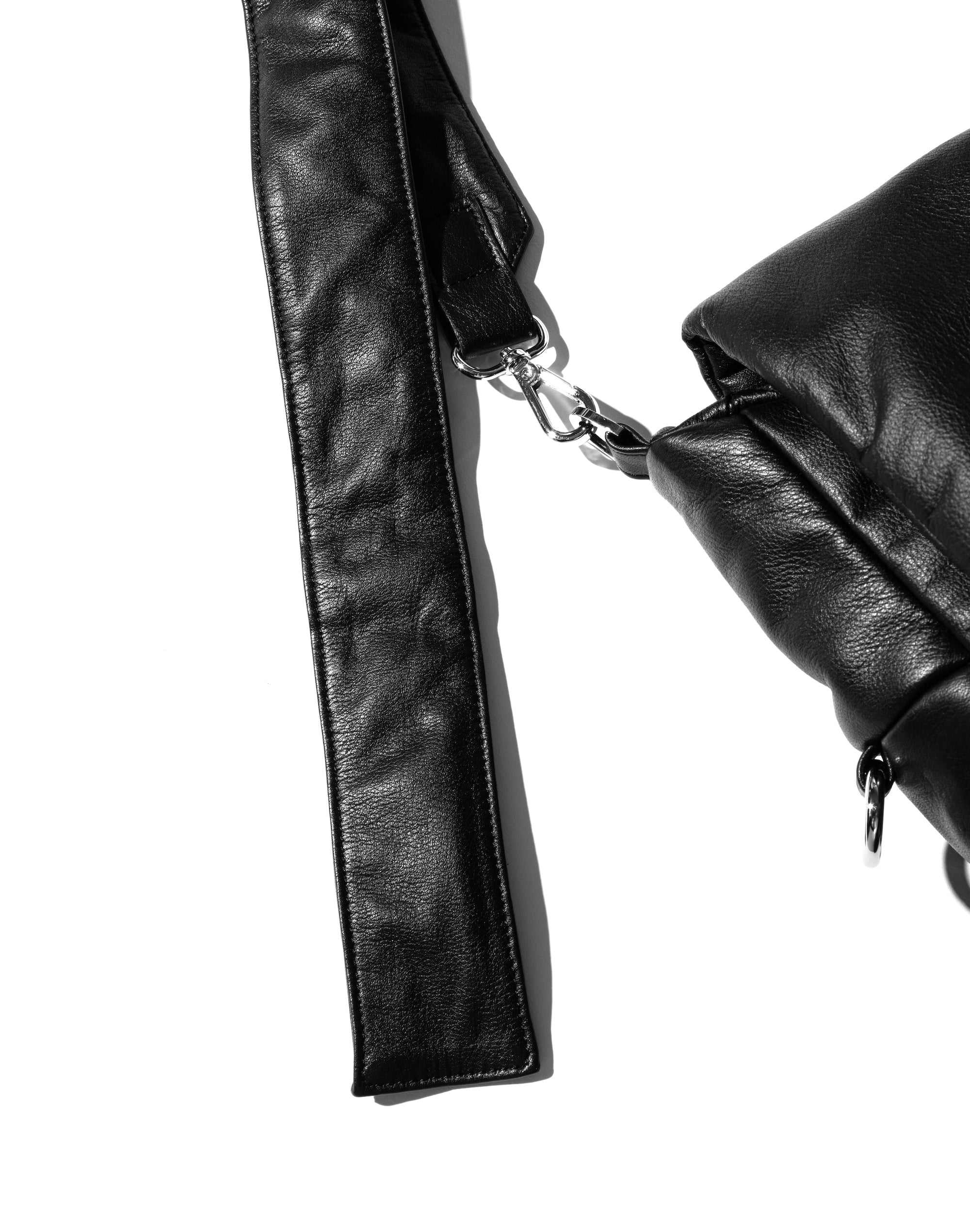 CLESSTE LEATHER PADDED FLAP HOLIDAY BAG