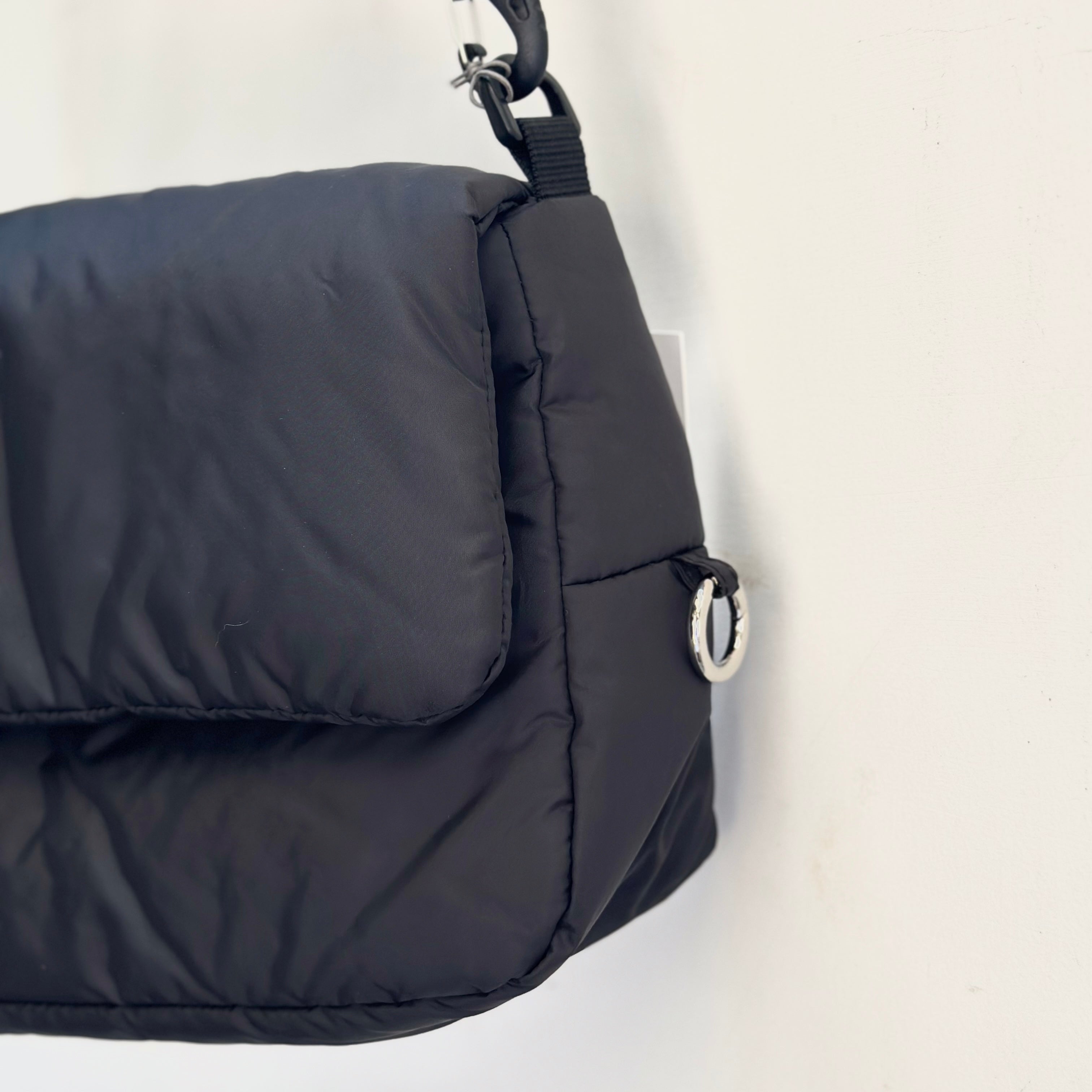 CLESSTE PADDED FLAP HOLIDAY BAG