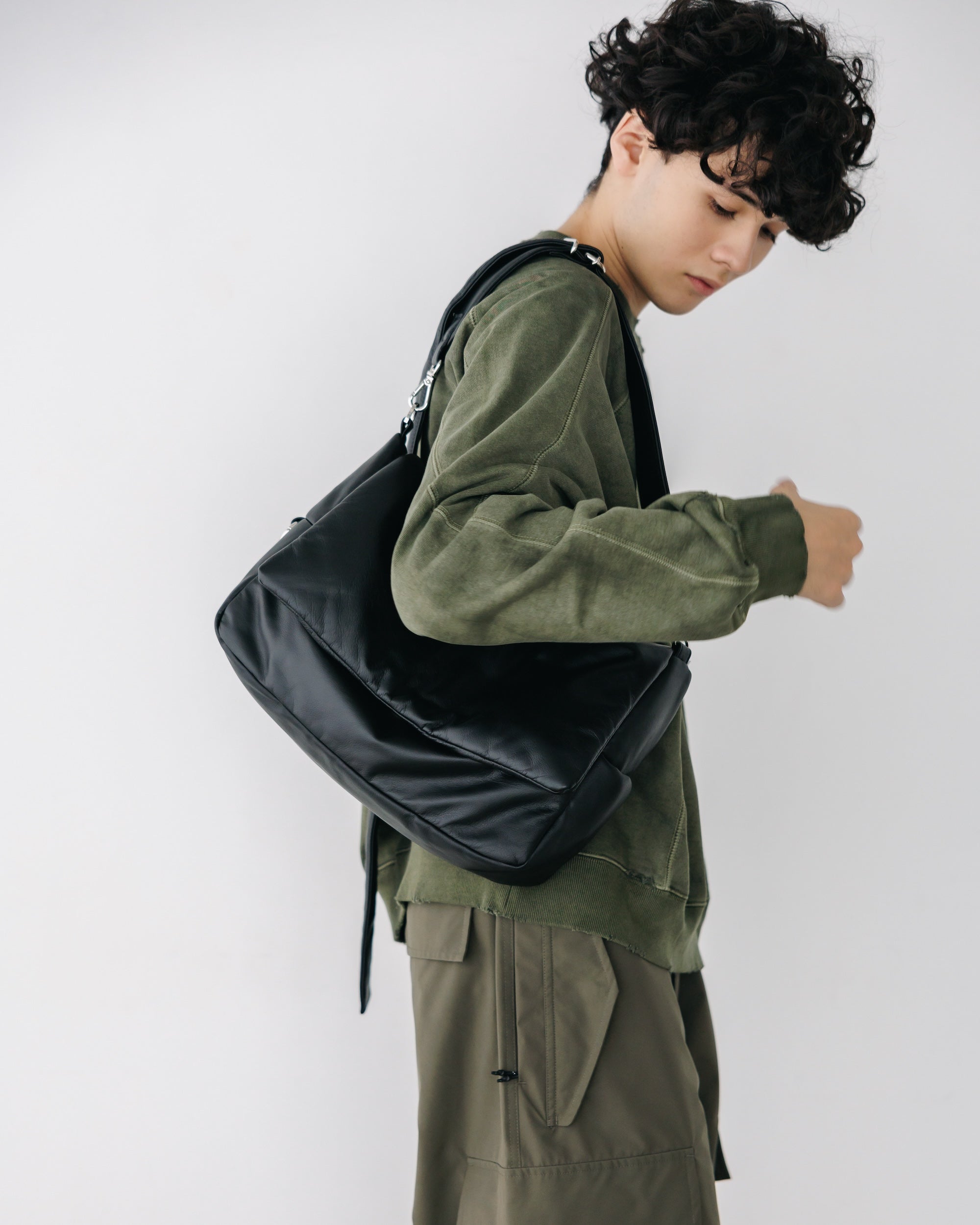CLESSTE LEATHER PADDED FLAP HOLIDAY BAG