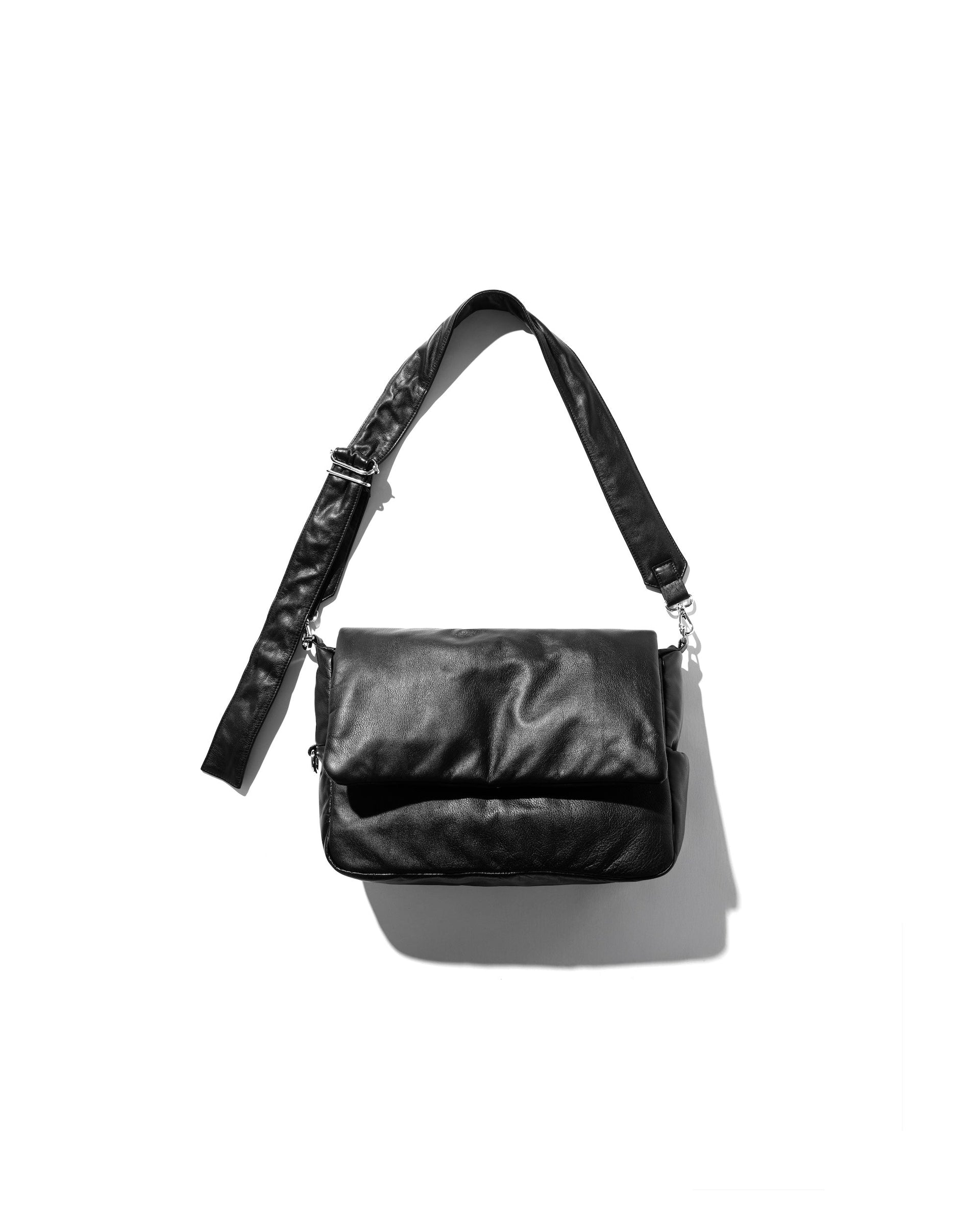 CLESSTE LEATHER PADDED FLAP HOLIDAY BAG
