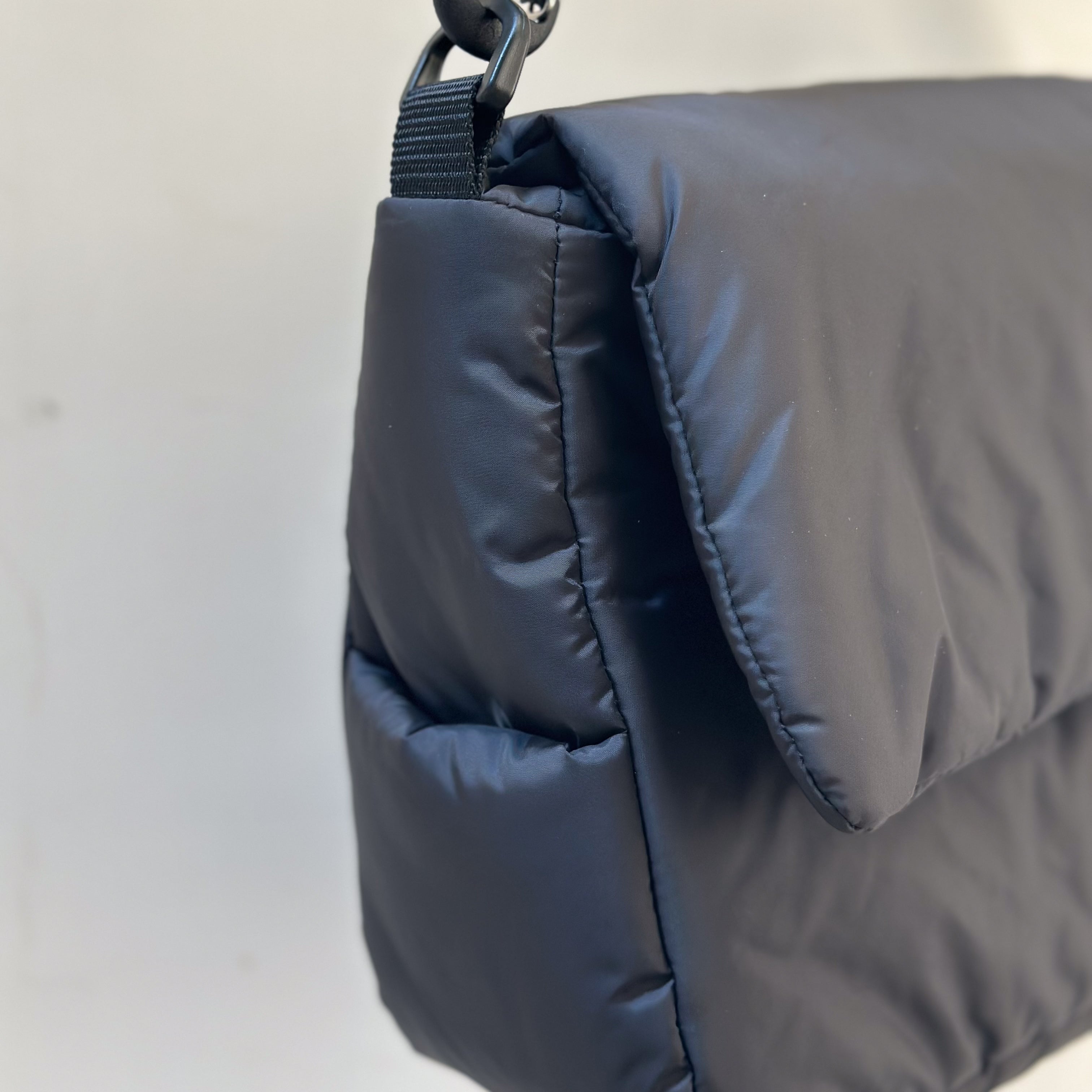 CLESSTE PADDED FLAP HOLIDAY BAG