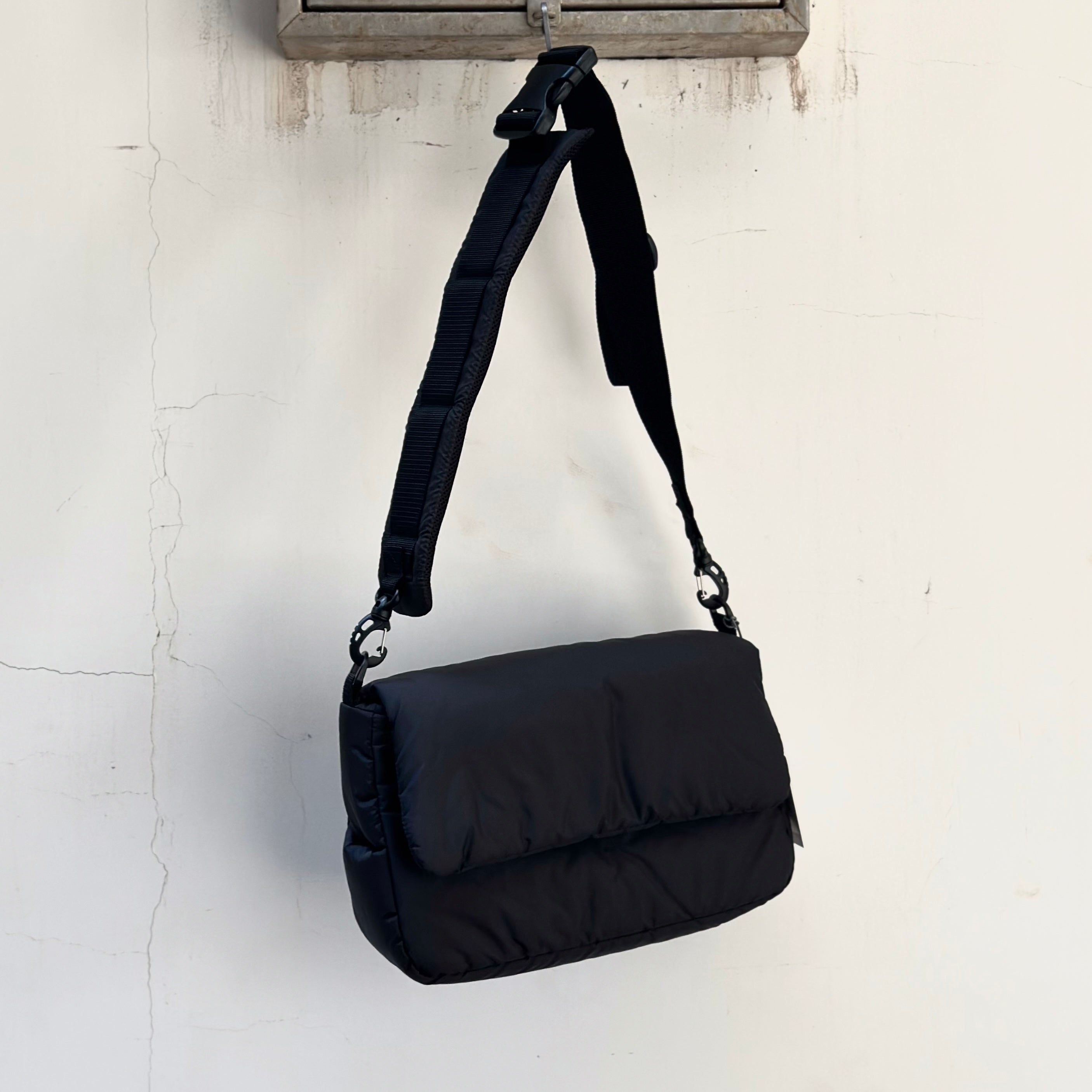 CLESSTE PADDED FLAP HOLIDAY BAG