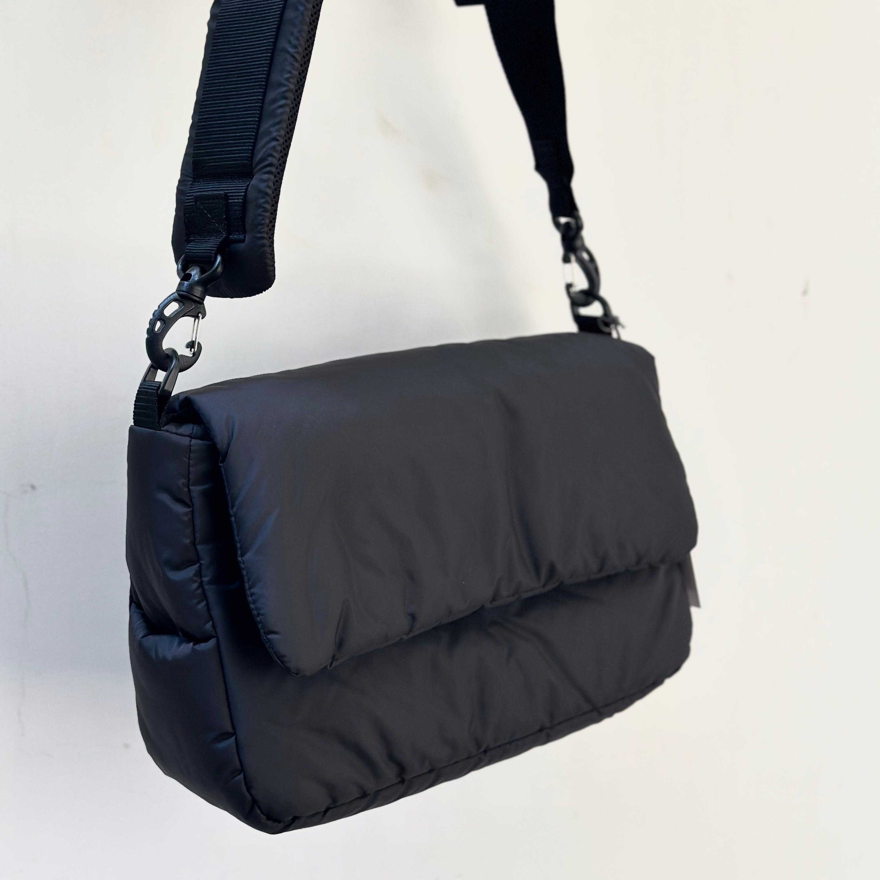 CLESSTE PADDED FLAP HOLIDAY BAG