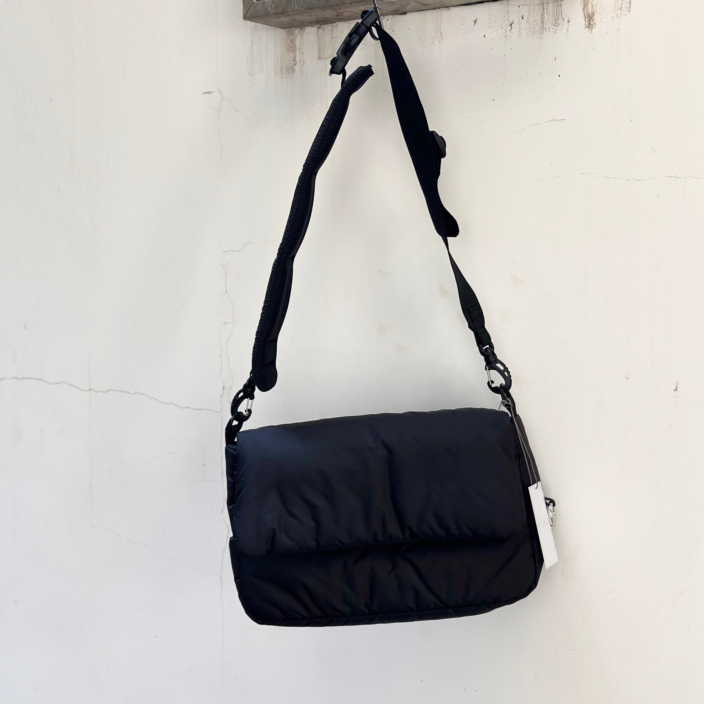 CLESSTE PADDED FLAP HOLIDAY BAG